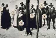 Dutch immigrants eating cake donuts.